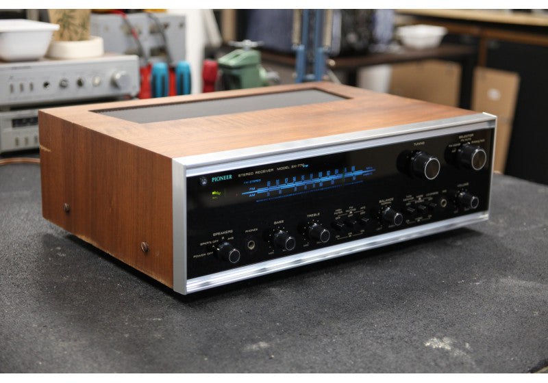 Reference photograph of a Pioneer SX-770 receiver with wood cabinet and illuminated dial